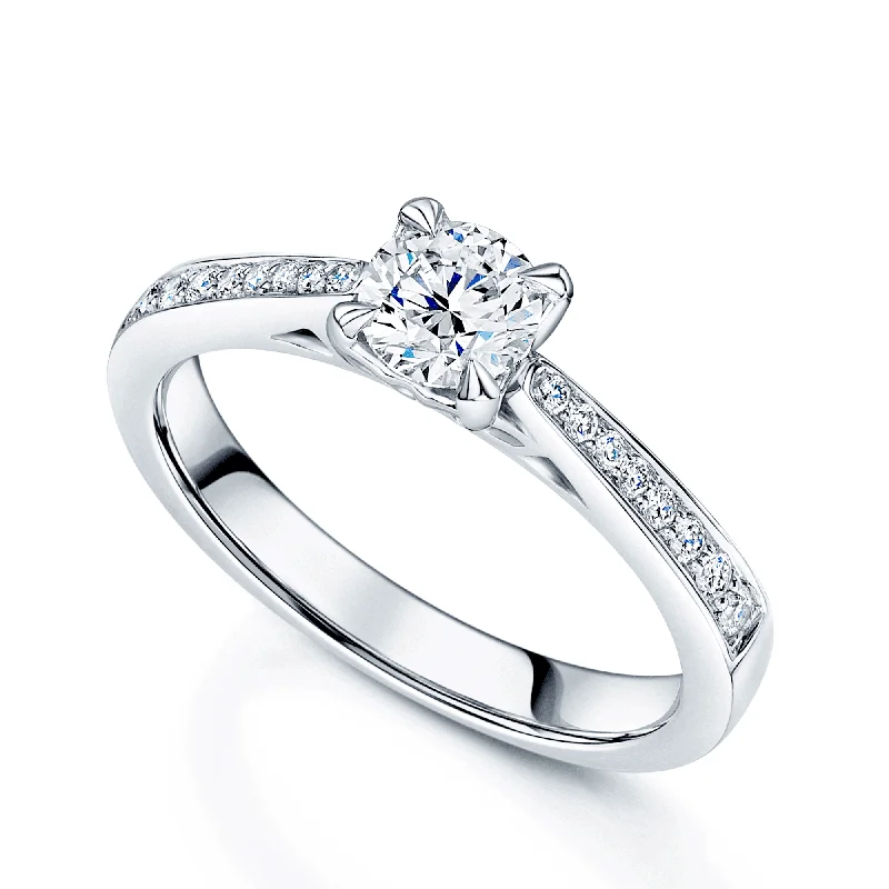 Modern engagement rings for women-Platinum Round Brilliant Cut Diamond Single Stone Ring With Diamond Set Shoulders