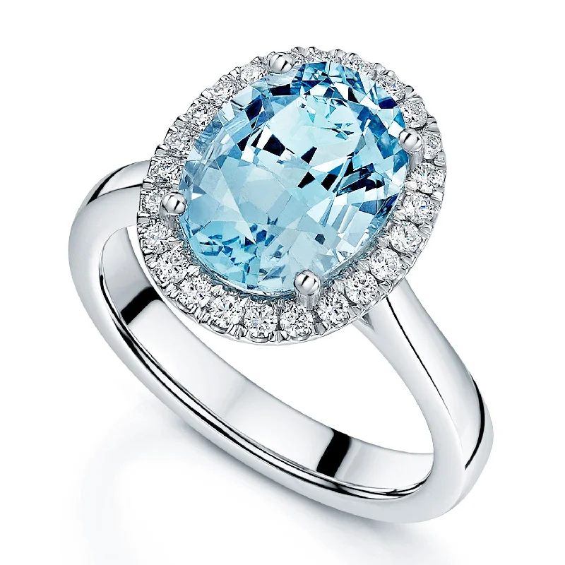 Affordable gold engagement rings for women-Platinum Oval Aquamarine And Diamond Halo Ring