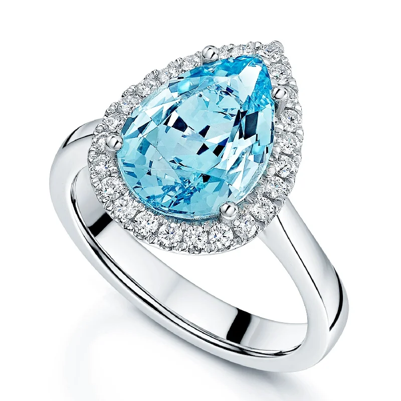 Engagement rings for women with vintage details-Platinum Pear shaped Aquamarine And Diamond Halo Ring