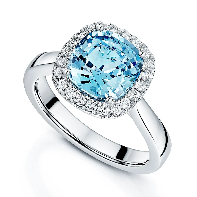 Classic solitaire engagement rings for women-Platinum Cushion Cut Aquamarine And Diamond Halo Ring