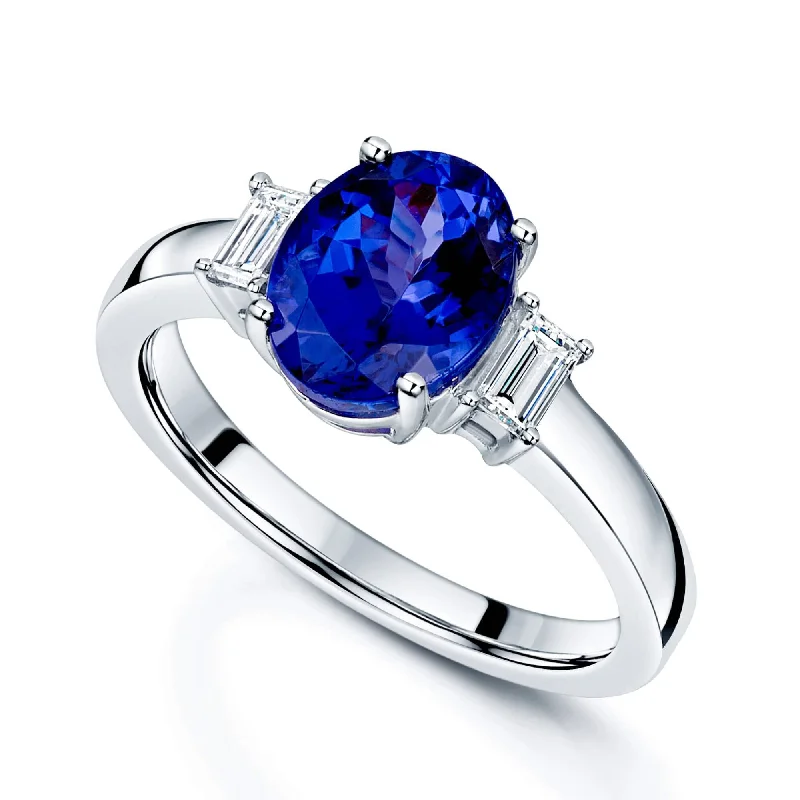 Engagement rings with oval cuts for women-Platinum Oval Cut Tanzanite Ring With Baguette Diamond Shoulders