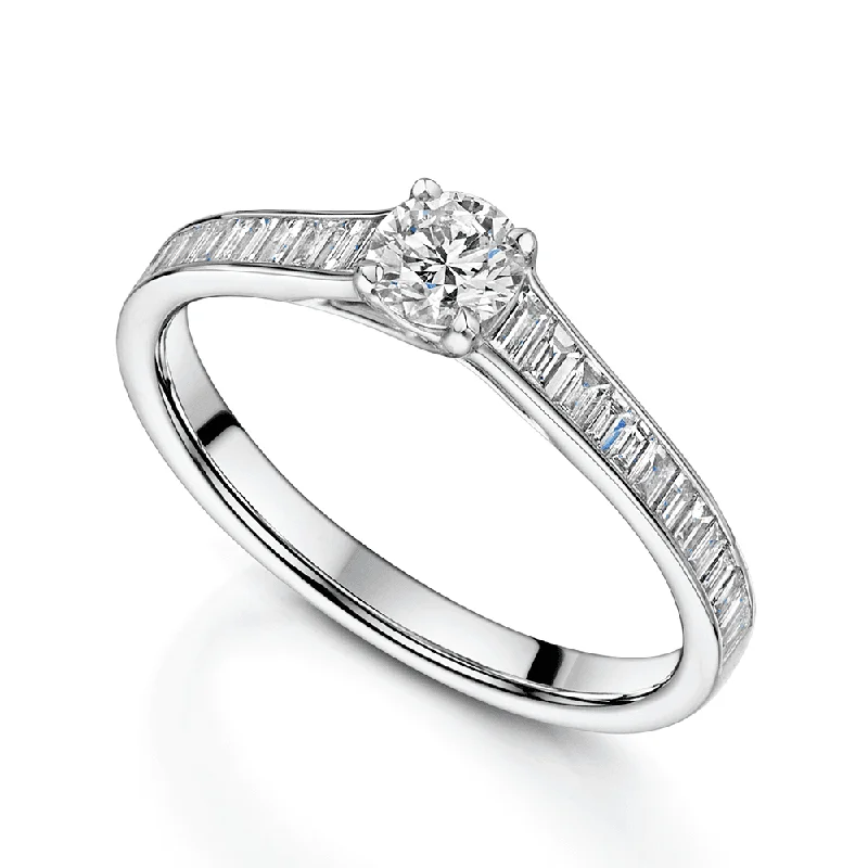 Engagement rings with a vintage feel for women-Platinum Round Brilliant Cut Diamond Single Stone Ring With Baguette Cut Diamond Shoulders