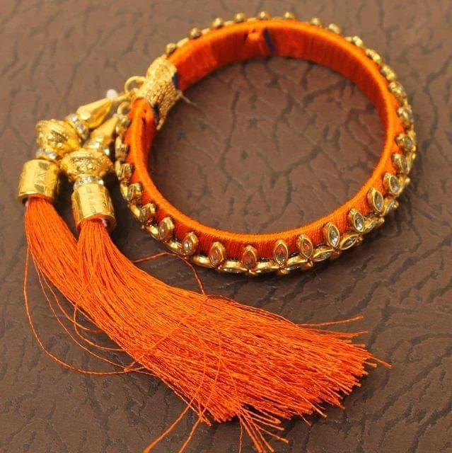 Luxury gold bracelet for women-Designer Kundan Silk thread Adjustable Bracelet With Latkan Orange